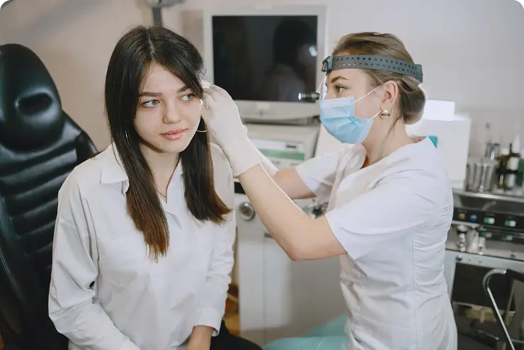 Dental professional performing diagnostic tests on patient