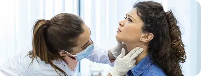 Dentist conducting a clinical assessment to diagnose the cause of TMJ