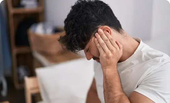 Man experiencing ear pain or pressure