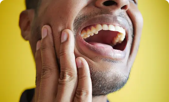 Man experiencing jaw pain or tenderness
