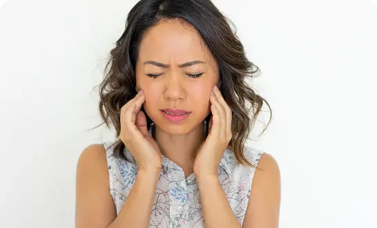 Woman experiencing jaw stiffness