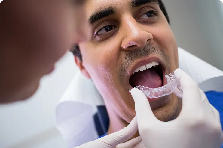 Dentist checking a patient's bite alignment