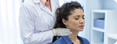 Dentist providing muscle relaxation therapy to relieve jaw pain