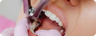 Periodontist performing gum surgery procedure