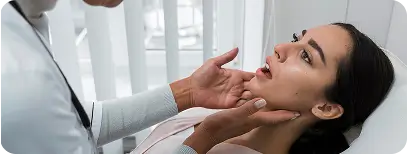 Dentist examining a patient's jaw movement and joint function